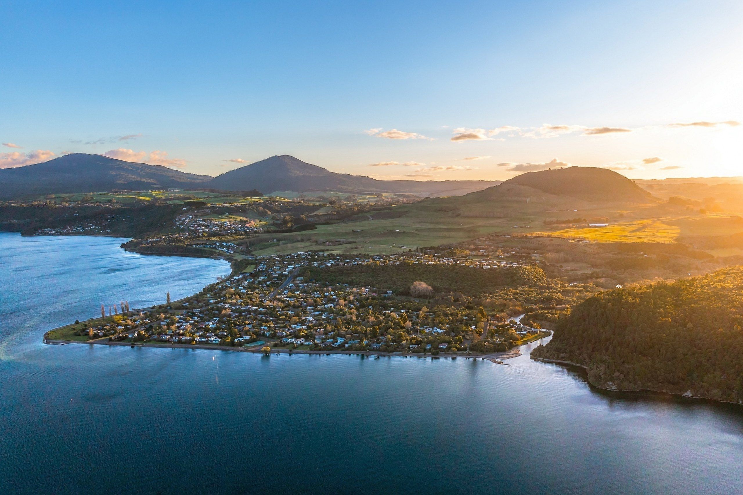 Golden-hour view over Kuratau, the lake and the surrounding hills
